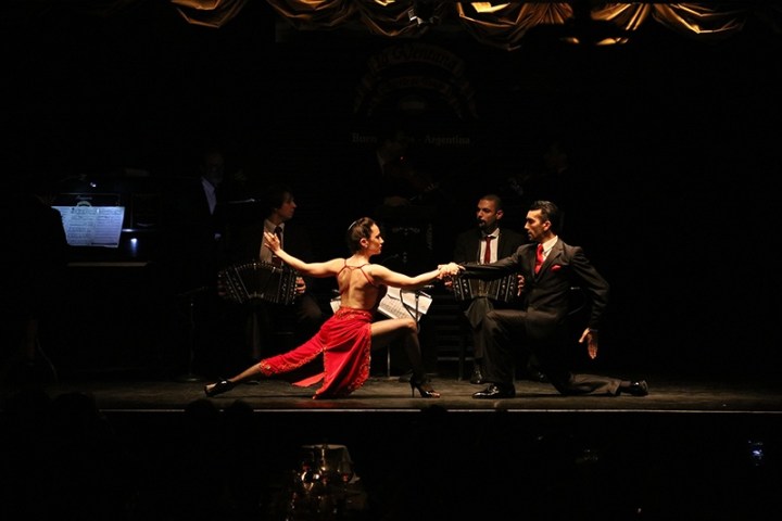 a man doing a trick on a stage