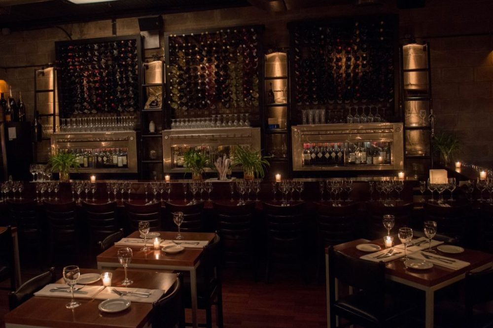 a dining room table filled with wine glasses