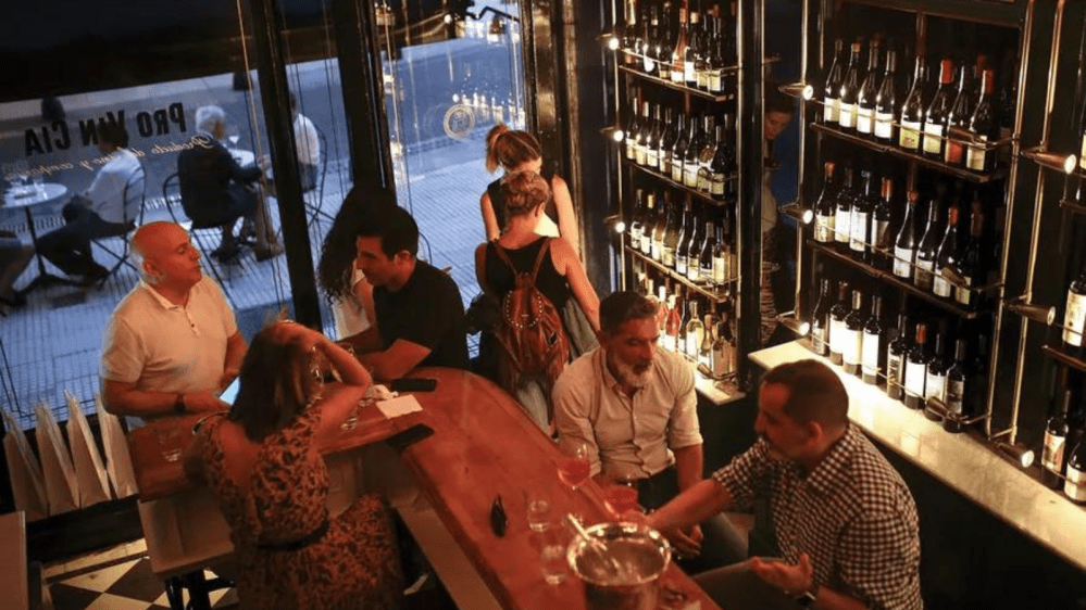 a group of people sitting at a table in a restaurant